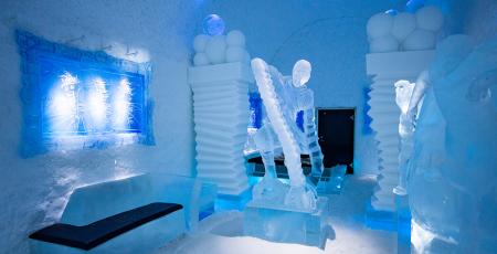 bedroom with ice art sculptures inside Icehotel