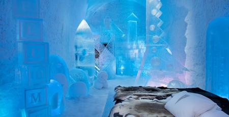 suite filled with toys made of ice and snow at Icehotel