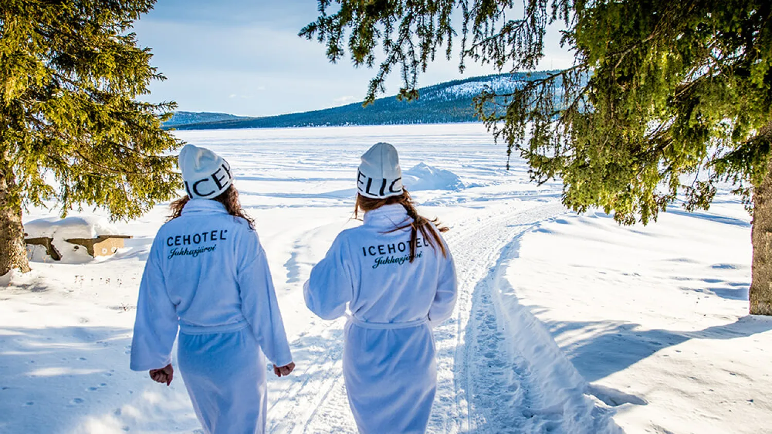 Two women walking through the snow