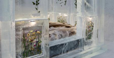Bed surrounded by ice with flowers