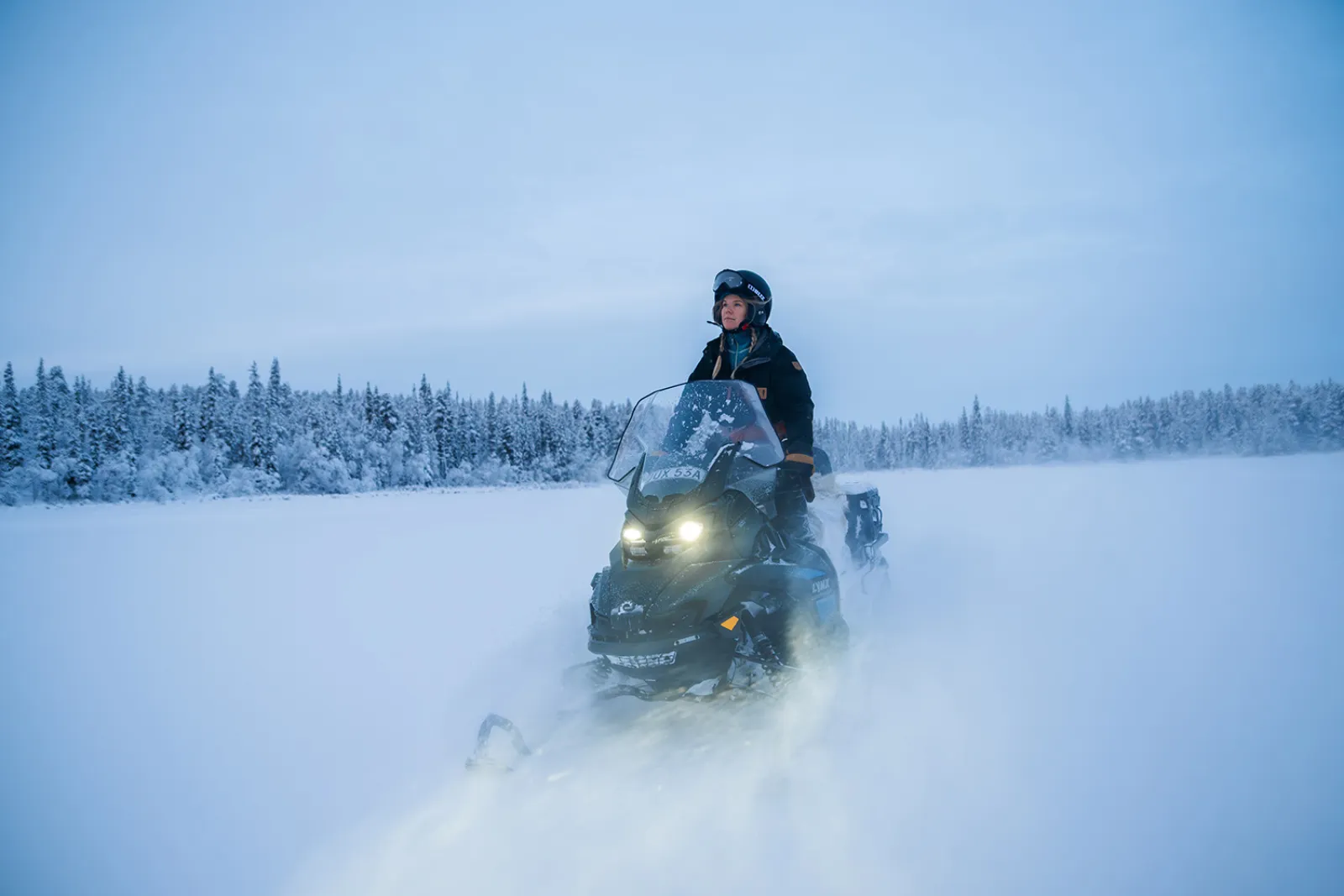 Snowmobile in winter landscape