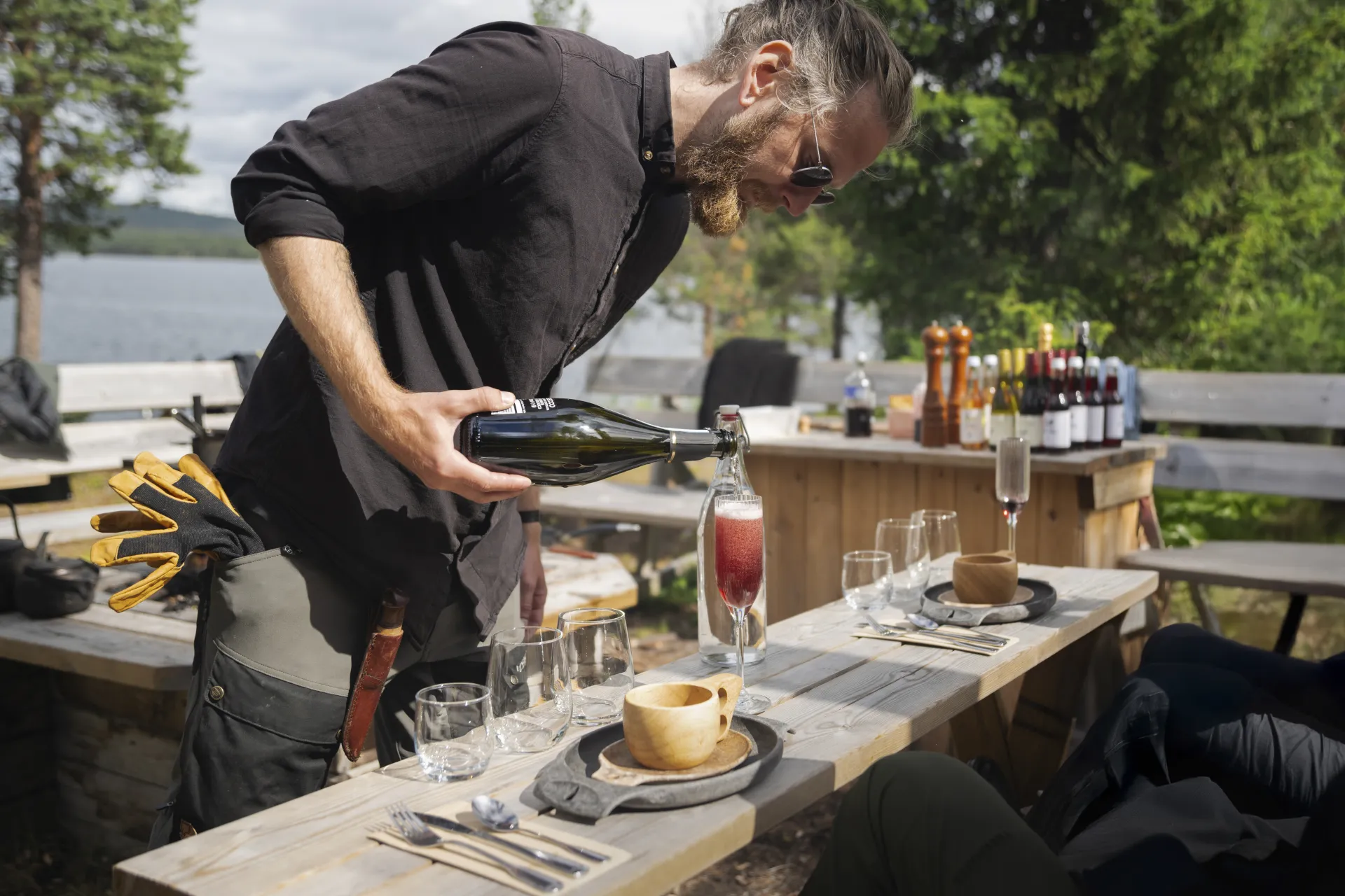 guide serving drinks at the wilderness dinner