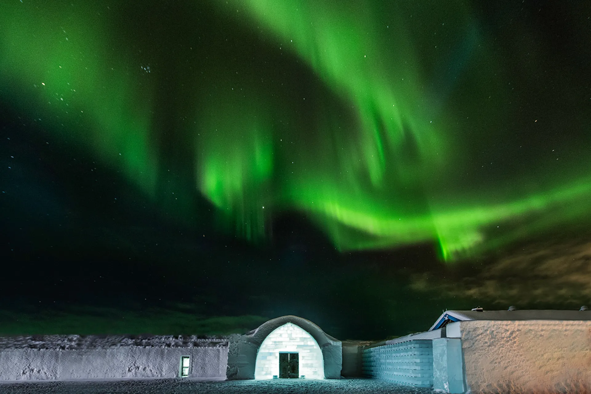 icehotel entrance with northern lights