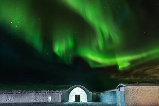 icehotel entrance with northern lights